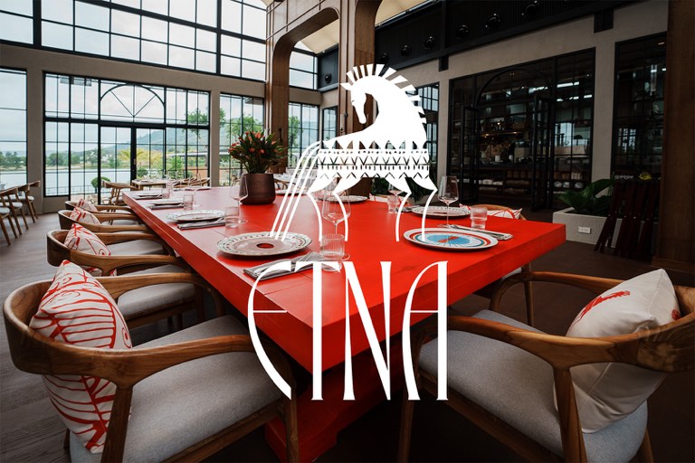 ETNA restaurant interior with red dining table and logo
