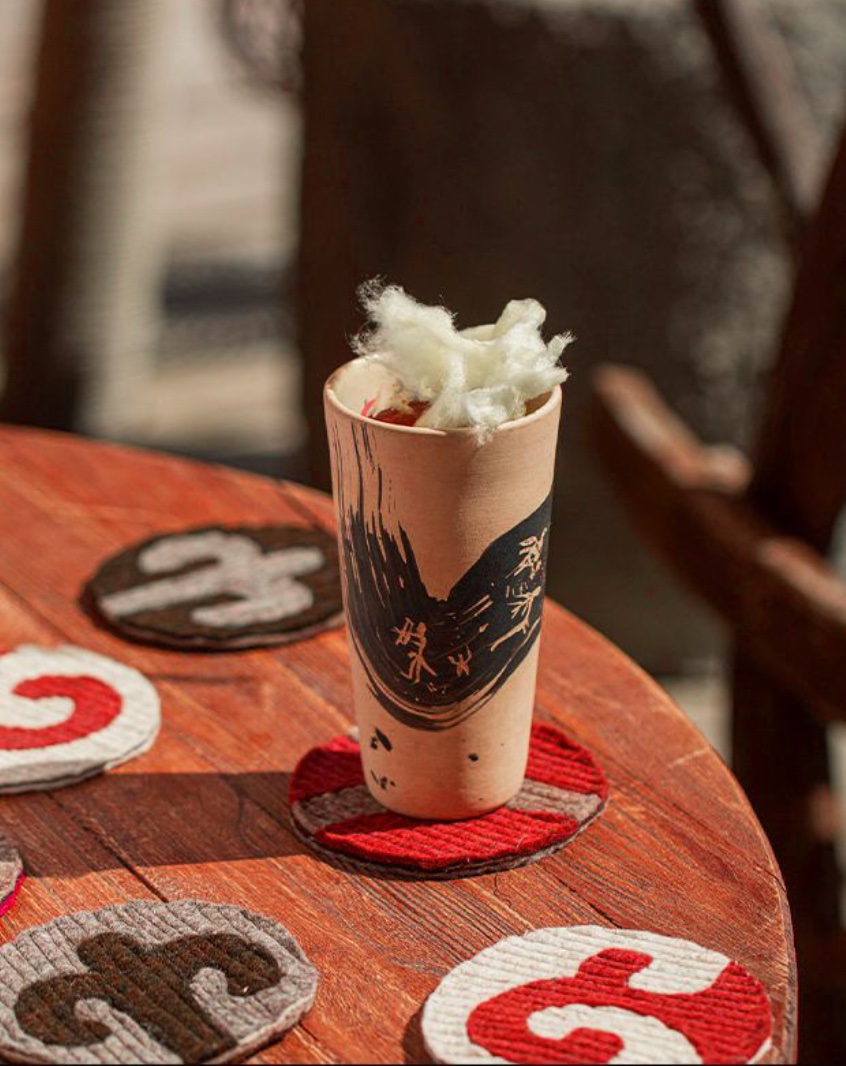 Branded drink and embroidered coasters in a restaurant