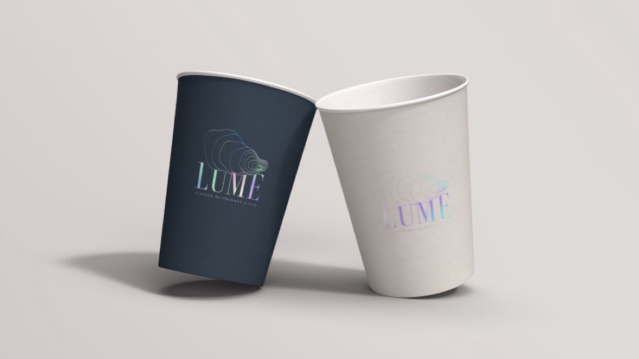 LUME brand identity applied to dark blue and cream paper cups